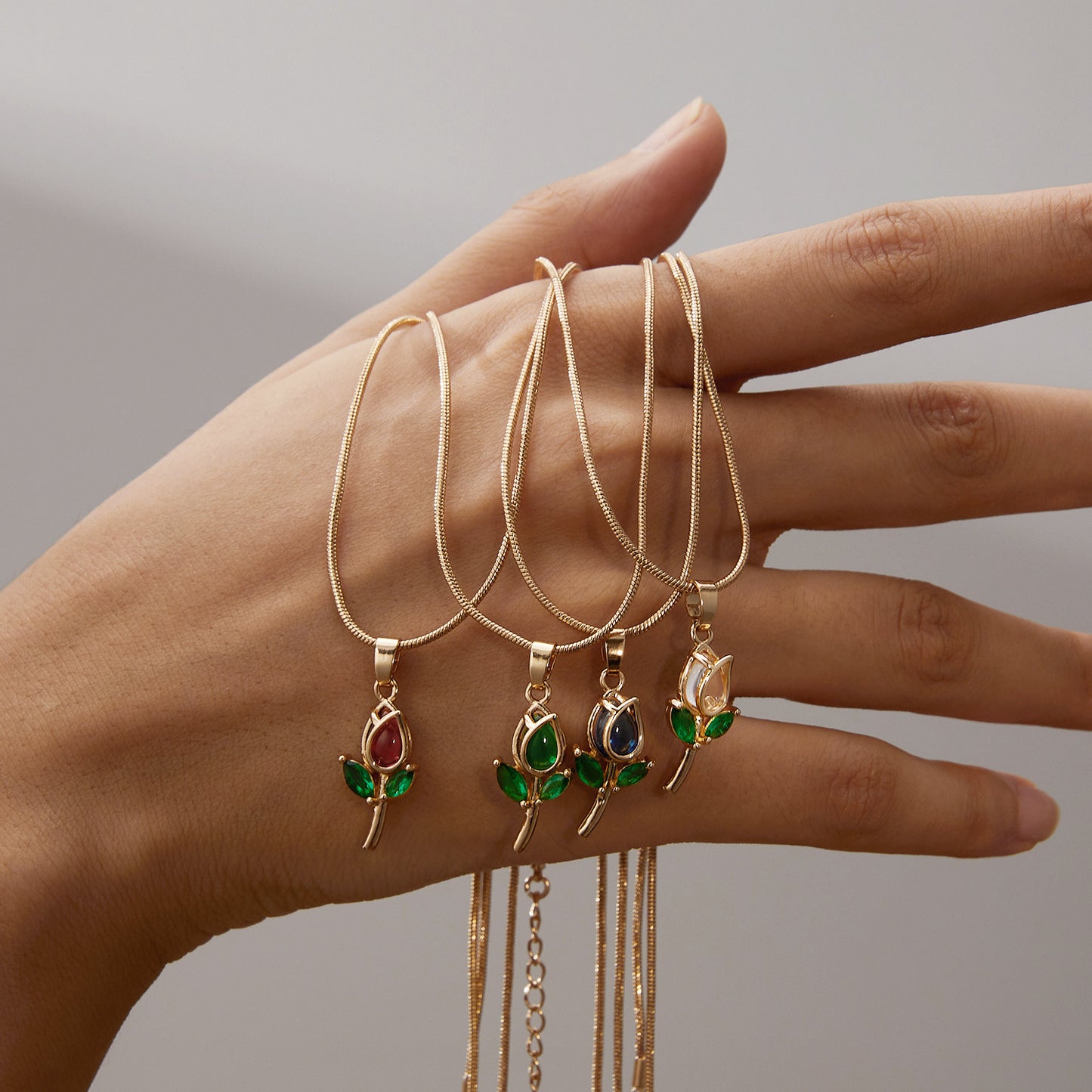 Gold chain with tulip pendant